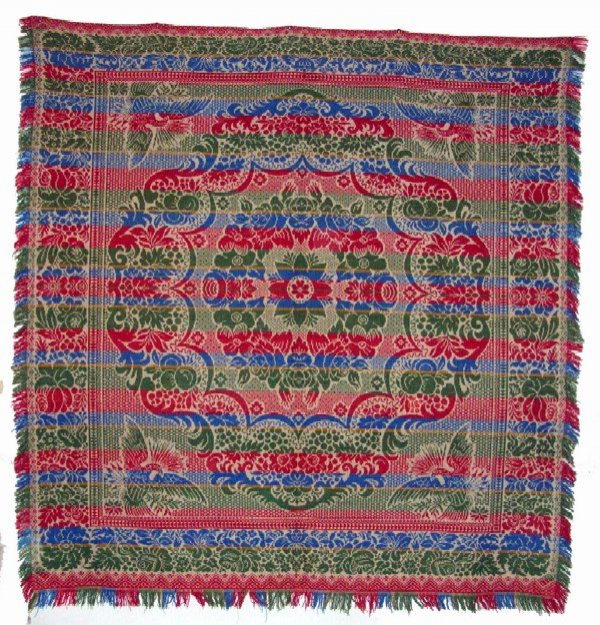 Appraisal: Coverlet of cream ground with blue red and green Scroll