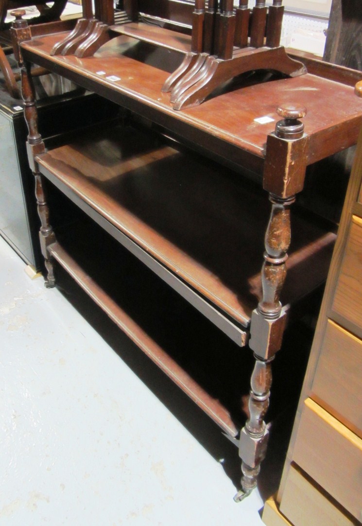 Appraisal: A Victorian mahogany three tier buffet