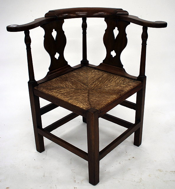 Appraisal: A TH CENTURY CORNER ARMCHAIR with pierced splat back and