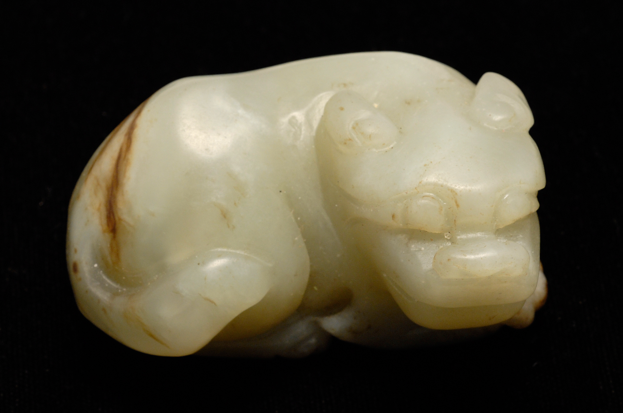 Appraisal: GRAY JADE CARVING In the form of a reclining lion