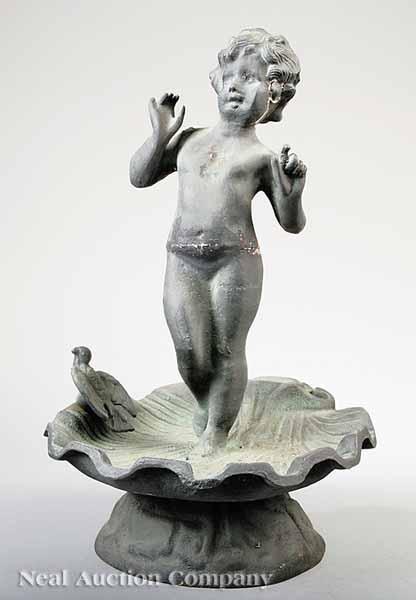 Appraisal: An Antique Cast Iron Garden Statue of a Putto c