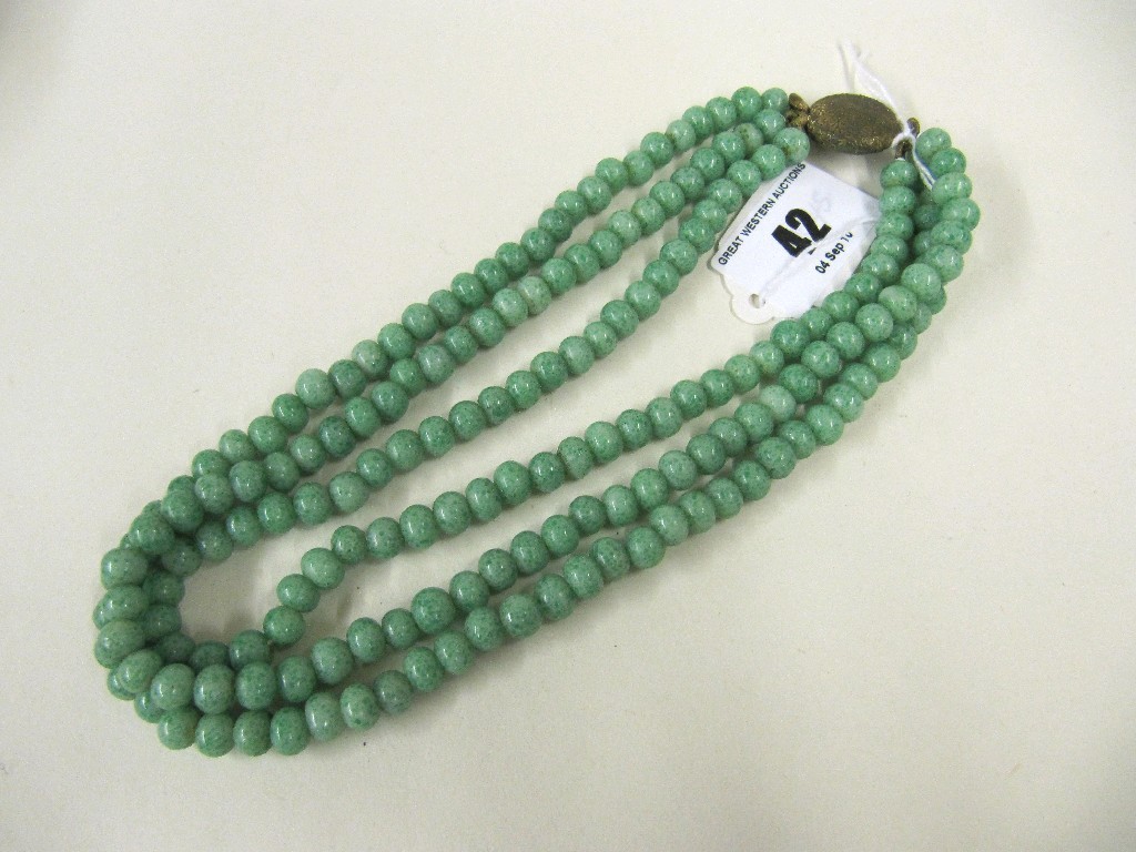 Appraisal: Three strand jade necklace