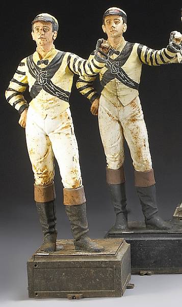 Appraisal: A pair of American painted cast iron lawn jockeys first