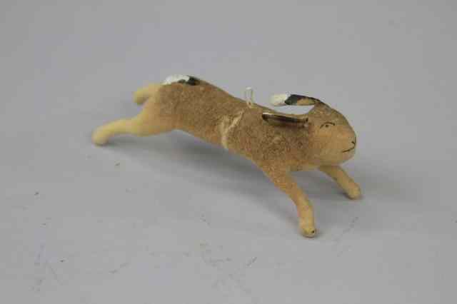 Appraisal: LEAPING RABBIT PRESSED COTTON ORNAMENT Germany pressed cotton white tail