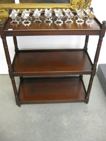 Appraisal: Mahogany Bookcase triple tier with rollers tall deep wide