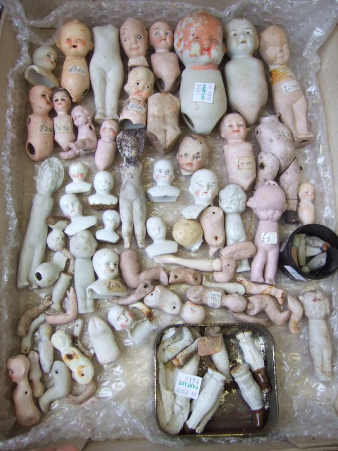 Appraisal: A quantity of miniture bisque dolls bodies arms and legs