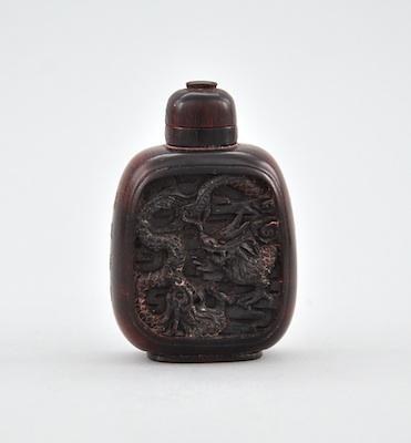 Appraisal: A Very Fine Carved Horn Snuff Bottle Carved rhinoceros horn