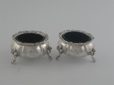 Appraisal: A pair of George IV squat circular salts on three