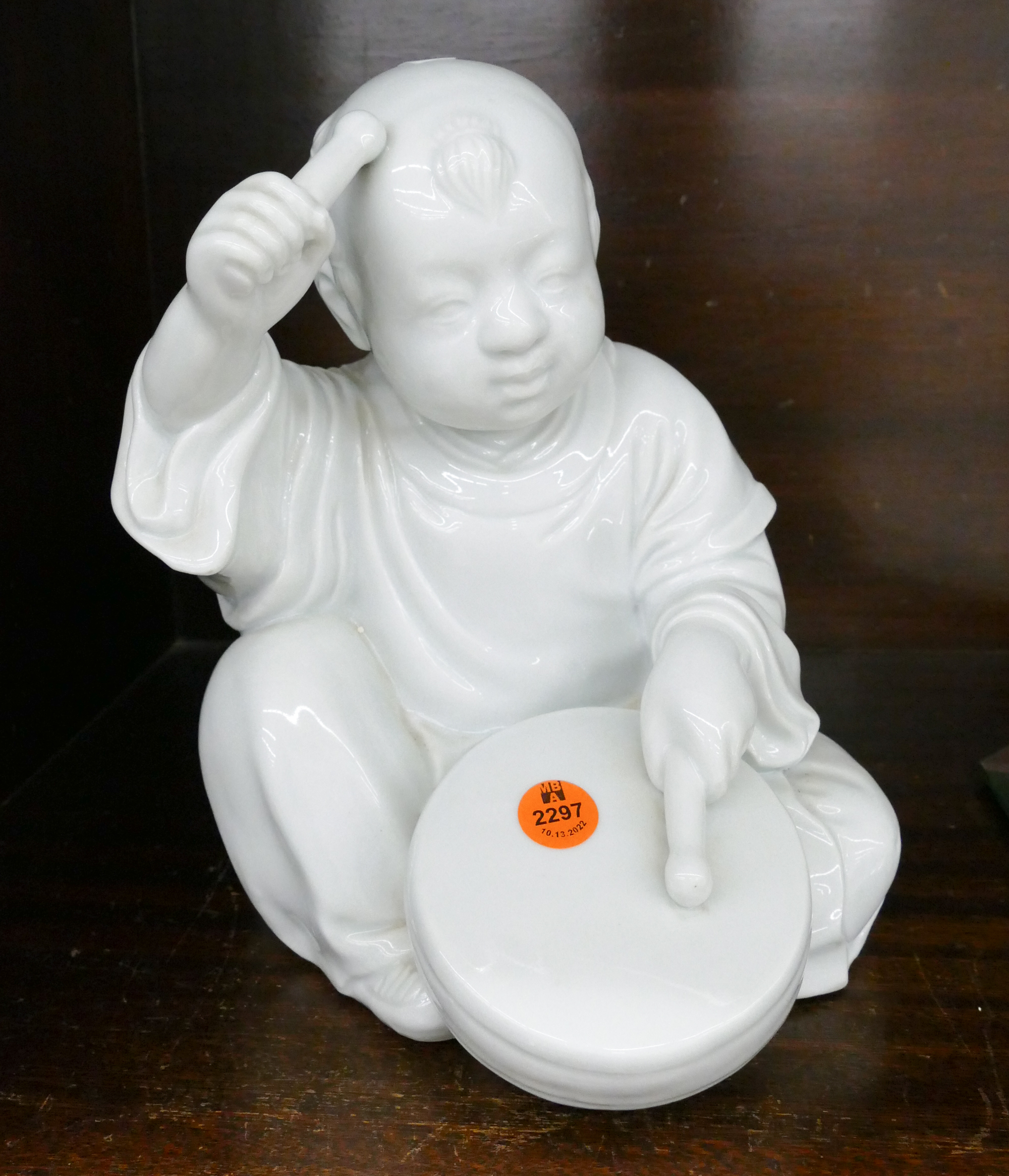 Appraisal: Chinese Republic Drumming Boy Blanc de Chine Figure- ''