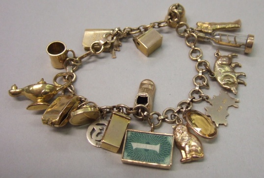 Appraisal: A gold circular and oval link charm bracelet with eighteen