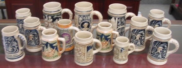 Appraisal: A COLLECTION OF FOURTEEN GERMAN BEER STEINS with sizes ranging