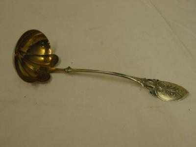 Appraisal: AN ART NOUVEAU LADLE the shaped bowl with gilded interior