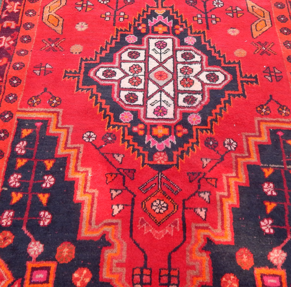 Appraisal: An Ardebil runner on red ground with blue lozenge detail