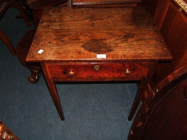 Appraisal: A Georgian elm and oak side table with single frieze