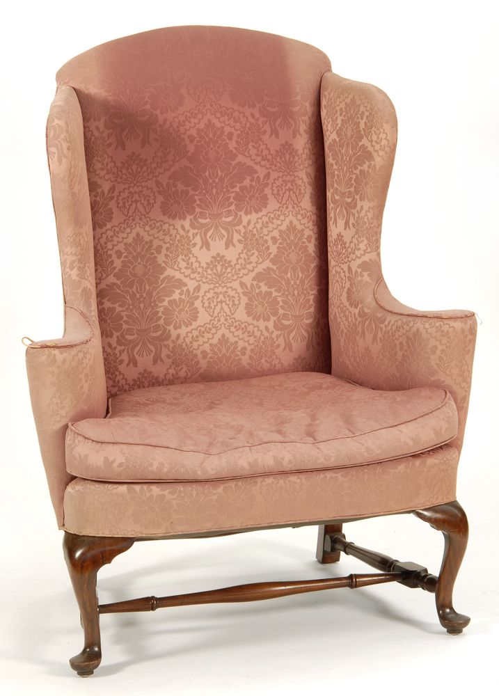 Appraisal: QUEEN ANNE-STYLE UPHOLSTERED WING CHAIR In mahogany with turned H