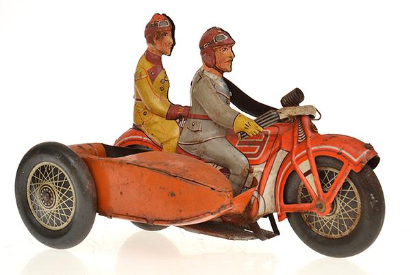 Appraisal: TINPLATE CLOCKWORK MOTORCYCLE AND SIDECAR red lithographed motorcycle with rider