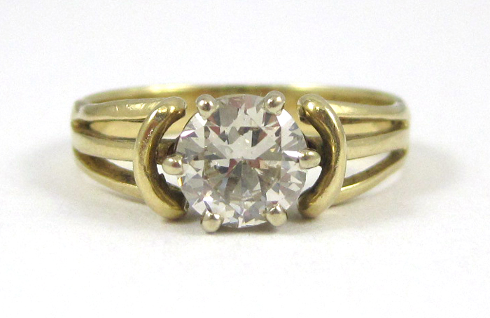 Appraisal: DIAMOND AND FOURTEEN KARAT GOLD SOLITAIRE RING with PGL appraisal