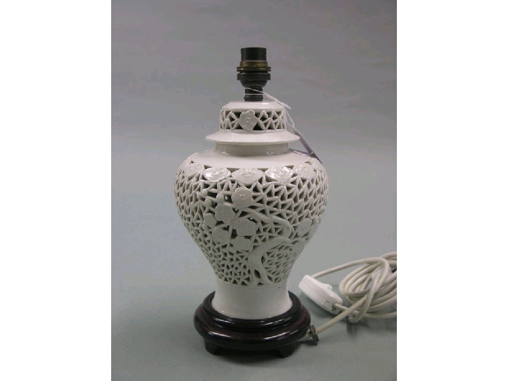 Appraisal: A continental 'blanc-de-chine' porcelain table lamp and cover pierced with