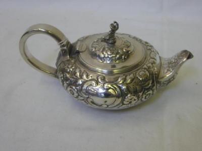 Appraisal: A GEORGE IV TEAPOT of flattened pumpkin form with china