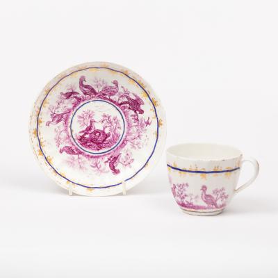 Appraisal: A Derby cup and saucer circa later decorated in puce