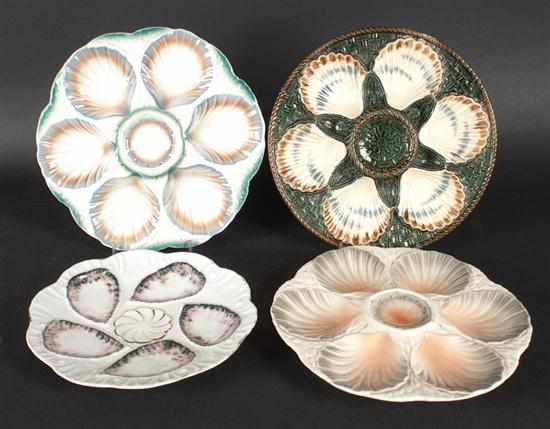 Appraisal: Four French ceramic and porcelain oyster plates Two Sarreguemines one