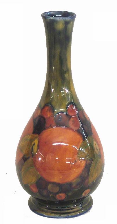 Appraisal: William Moorcroft 'Pomegranate' bottle vase painted green mark and impressed