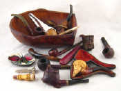 Appraisal: A quantity of about tobacco pipes rests and cigarette holders