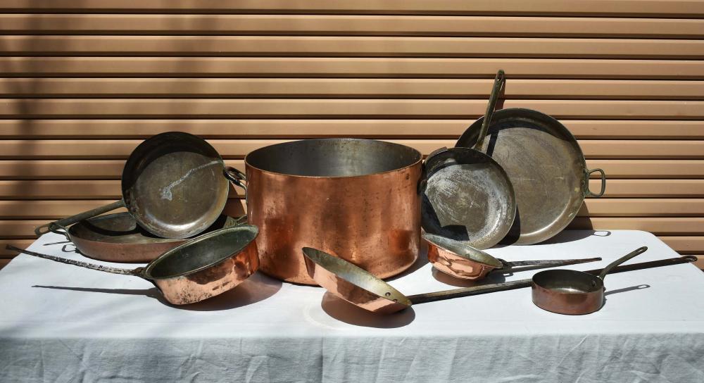 Appraisal: NINE ANTIQUE VINTAGE COPPER BRASS COOKWARE PIECESMost French Late th