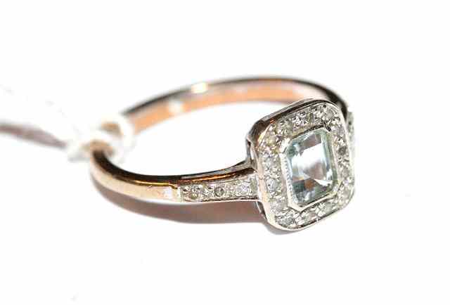 Appraisal: A CONTEMPORARY AQUAMARINE AND DIAMOND SET DRESS RING emerald cut