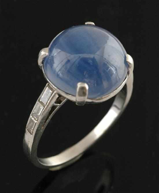 Appraisal: A star sapphire and diamond ring The claw set sapphire