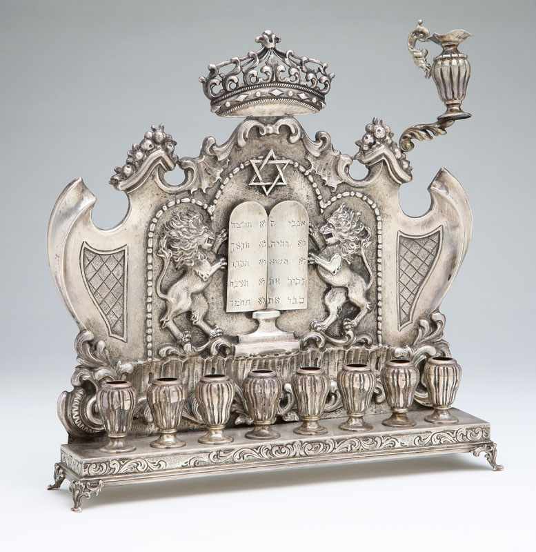 Appraisal: A Continental sterling silver repousse-decorated menorah th century probably Eastern