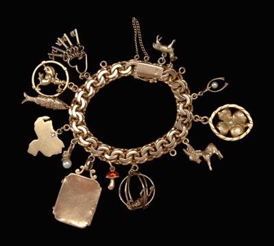 Appraisal: Gold charm bracelet kt yellow gold double-link bracelet with charms