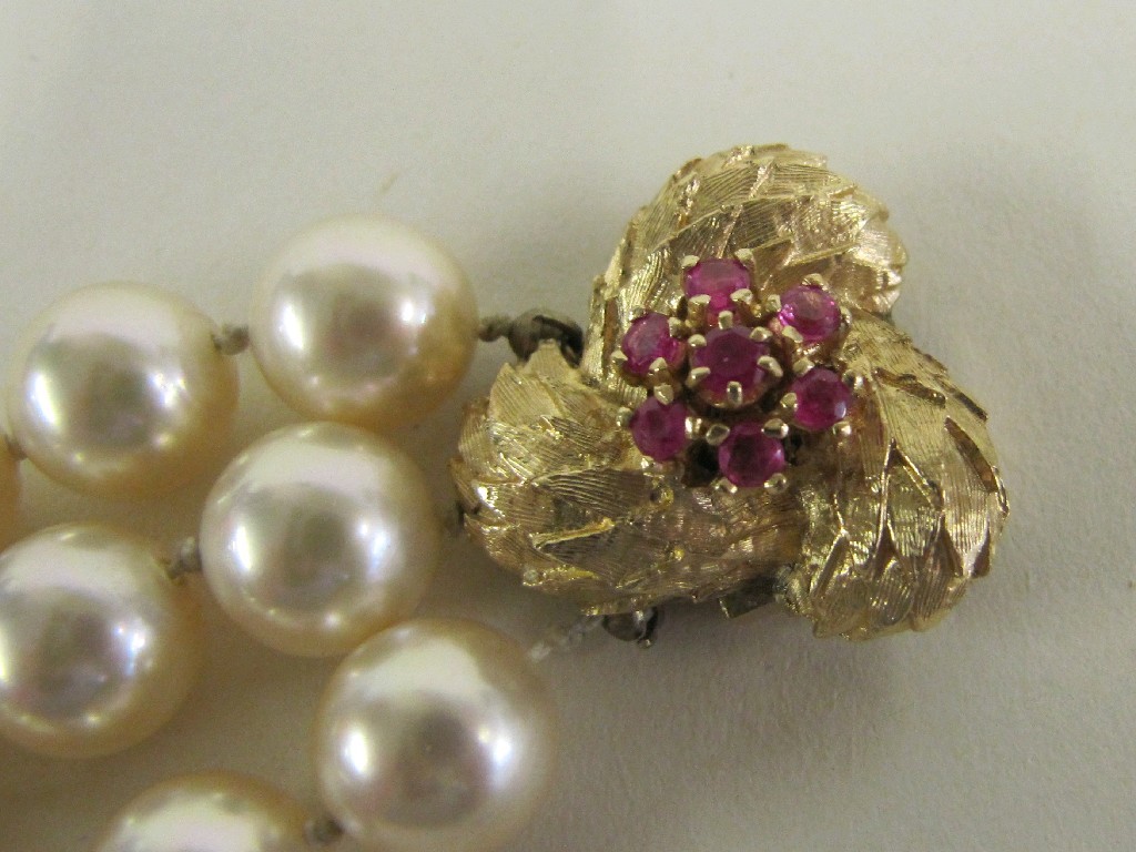 Appraisal: Three strand paste pearl bracelet with ct gold ruby set