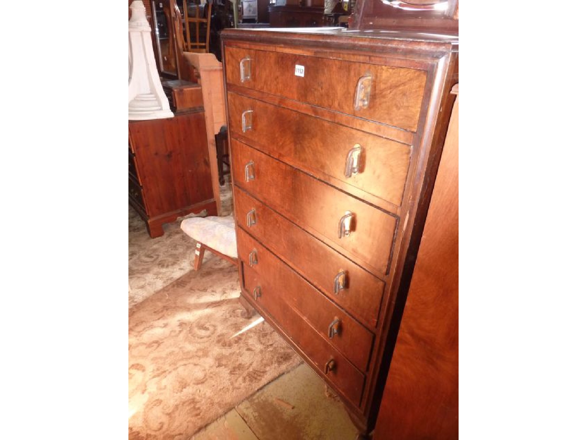 Appraisal: An Art Deco chest of six long drawers on short