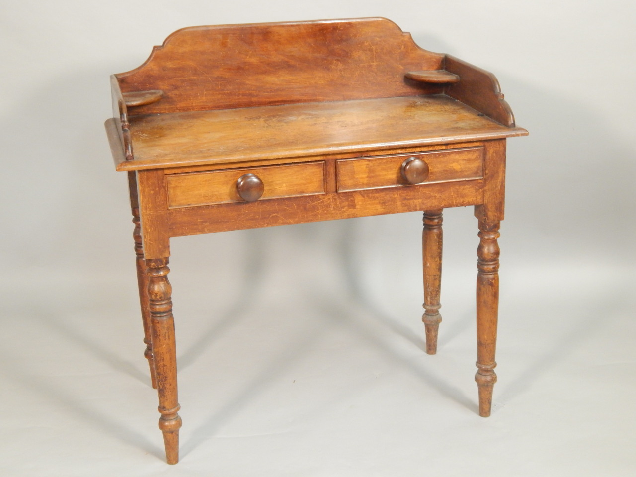 Appraisal: A Victorian stained pine wash stand the raised back above