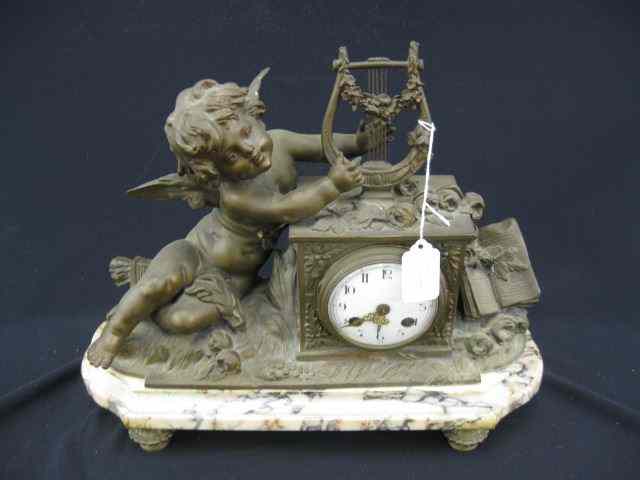 Appraisal: French Bronzed Figural Mantle Clock cherub Lyre decor marble base