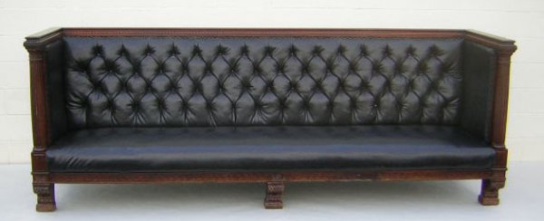 Appraisal: Divan Carved mahogany frame Black tufted upholstery Small plate with