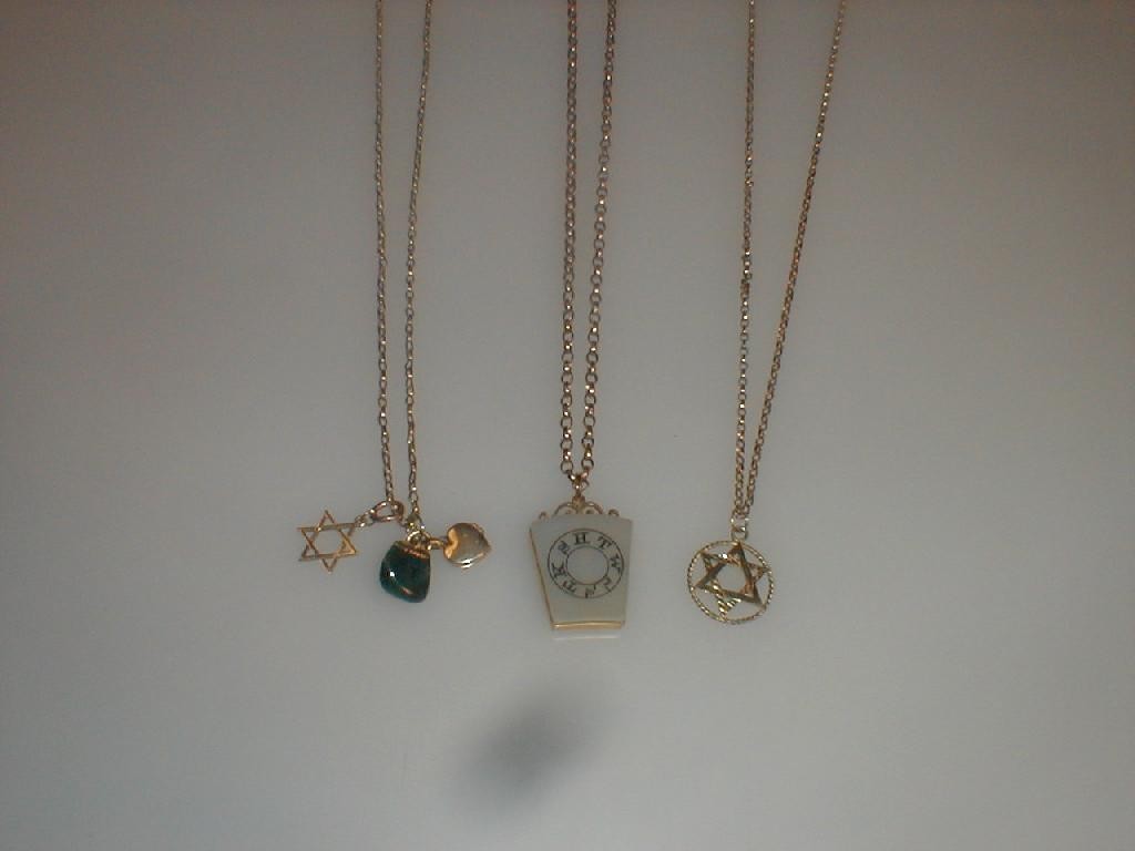 Appraisal: Three assorted pendants on chain various styles