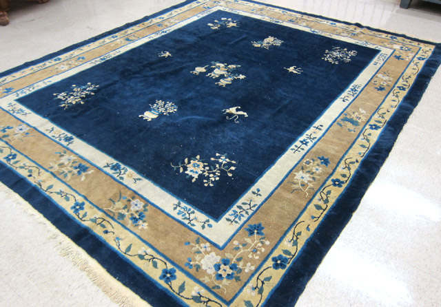 Appraisal: CHINESE SEMI-ANTIQUE CARPET traditional Peking design featuring a lightly decorated