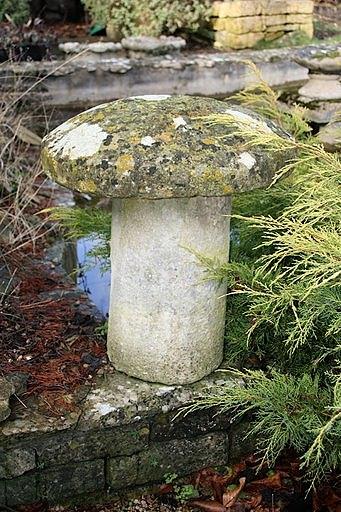 Appraisal: A staddle stone with a circular top and a cylindrical