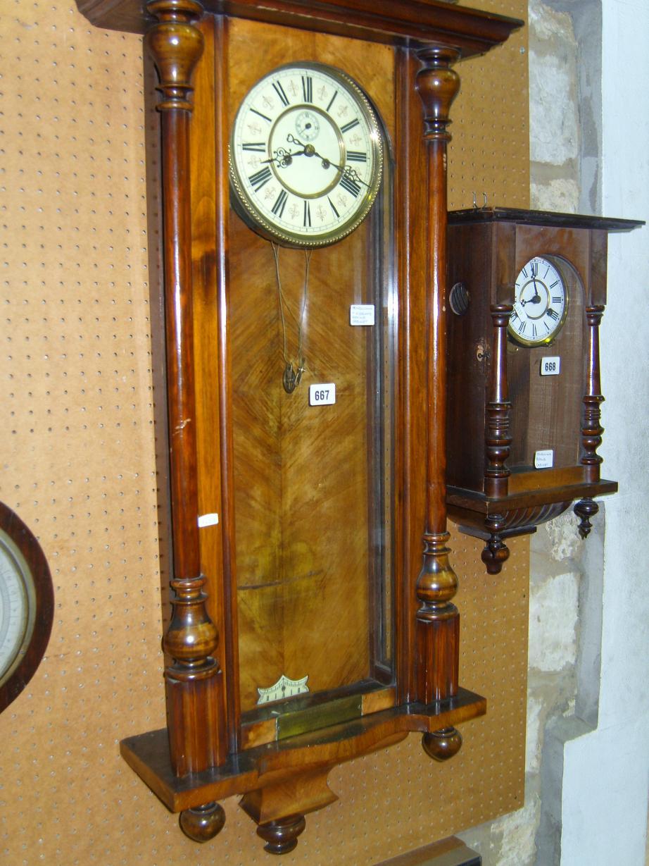 Appraisal: A th century walnut cased Vienna style wall clock with