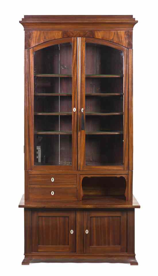 Appraisal: A Continental Mahogany Display Cabinet having a stepped top and