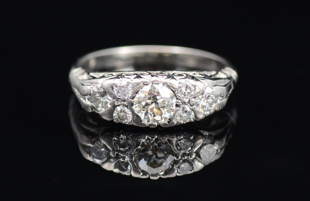 Appraisal: RETRO DECO PLATINUM DIAMOND RING The three larger diamonds total