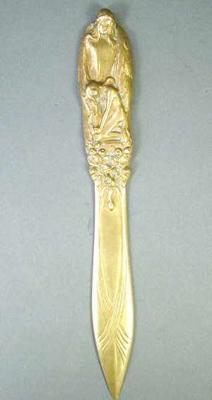 Appraisal: An Art Nouveau brass figural letter opener in the style