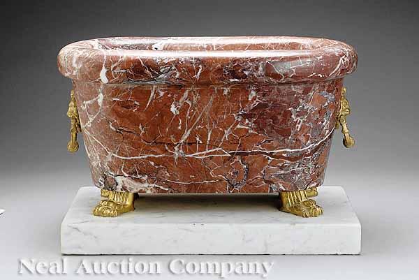 Appraisal: A Neoclassical Rouge Royal Marble and Bronze-Mounted Sarcophagus Form Jardini