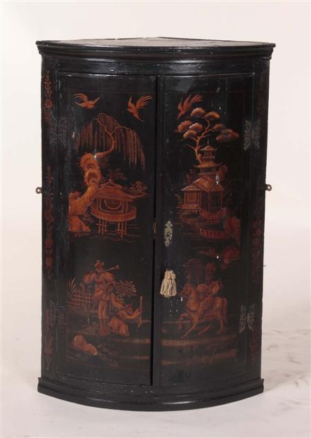 Appraisal: An th century lacquer corner cabinet the projected moulded cornice