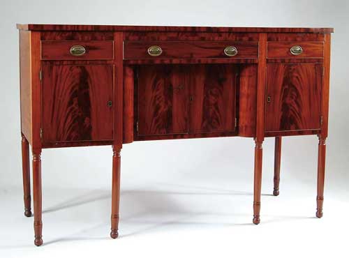 Appraisal: SHERATON MAHOGANY HUNTBOARD Three drawers over four doors having inset