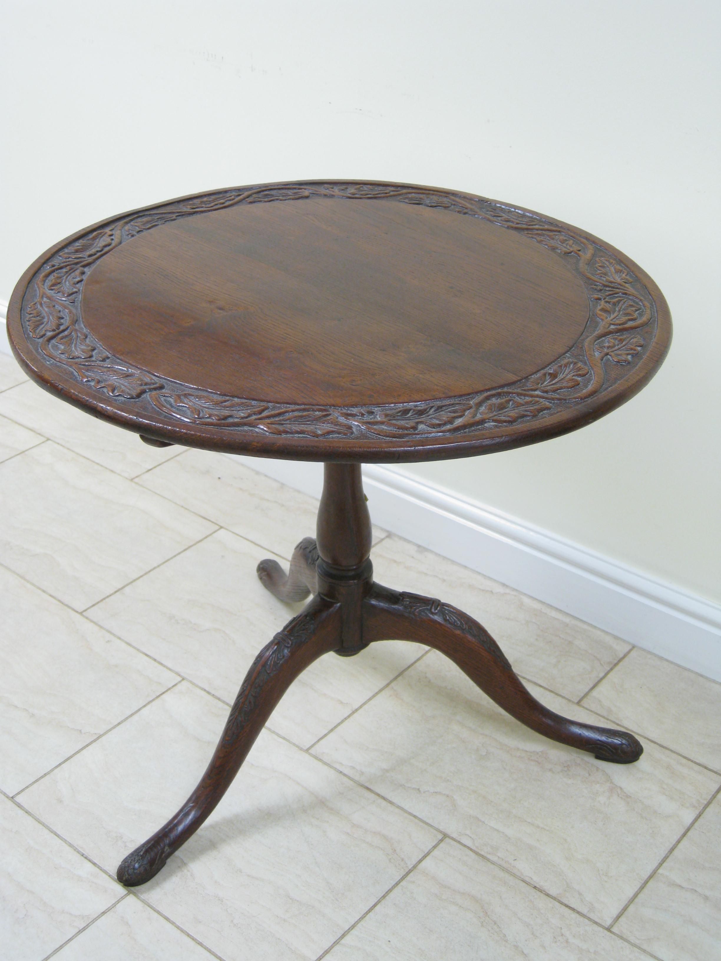 Appraisal: An antique oak Pillar Table with oak leaf carved circular