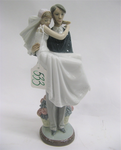 Appraisal: LLADRO GLAZED PORCELAIN FIGURINE Over The Threshold a groom carrying