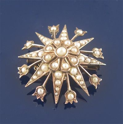 Appraisal: An Edwardian ct gold star brooch pendant set with graduated